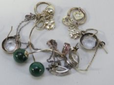 A silver necklace and four pairs of silver earrings
