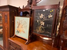 An antique mahogany inlaid fire screen together with a later fire screen. (2)