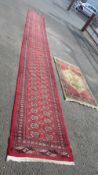 A long woollen runner together with another rug (2) runner is 6.8 m x 81 cm