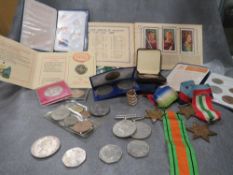 A tray of assorted vintage medals, coins and notes etc