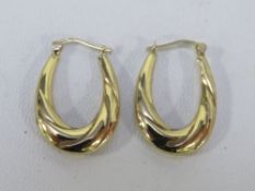 A pair of gold earrings stamped 375 approx weight 1.2g