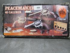 A boxed replica peacemaker handgun