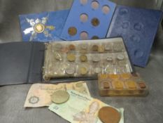 A collection of coins to include a Whitman folder of Victorian pennies etc