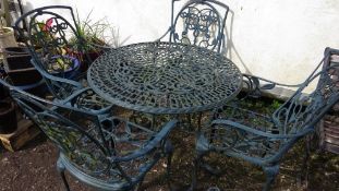 A cast aluminium garden / patio table set with four chairs