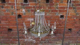 A small Empire style gilt and crystal glass chandelier
