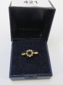 An 18ct gold dress ring set with a green stone approx weight 3g