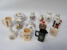 A small tray of collectable ceramics to include crested ware pepperettes with a Northern Ireland