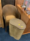 A Lloyd Loom armchair and linen bin. (2)
