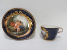 A miniature hand painted continental cup and saucer with cross swords marked to base
