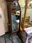 A 20th century cheval mirror. S/D
