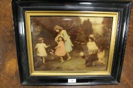 A Victorian framed crystoleum depicting children and a dog