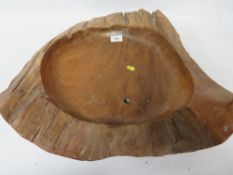 A large carved wooden bowl