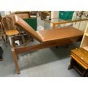 A vintage oak framed treatment couch