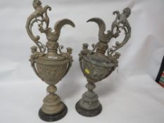 A pair of metal ewers A/F