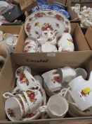 A matching bone china tea/dinner set comprising 3 tureens with lids, clock, 2 tea pots, coffee