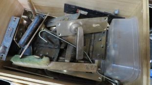 A wooden box of vintage brass door furniture