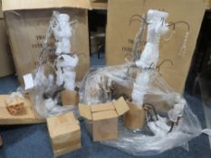 Two boxed bronzed six branch chandeliers - contents not checked