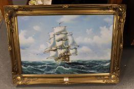 A modern oil on board depicting a sailing ship, in a gilt frame