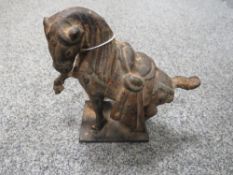 A cast metal tang style horse