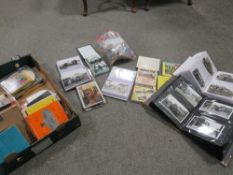 A tray of collectables to include two folders of antique postcards of Buses, Trams and