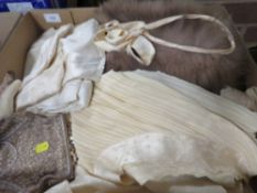 A tray containing fur cape, evening bag etc