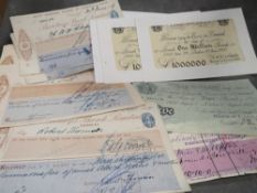 A quantity of antique cheques and replica £1,000,000 and £5 notes