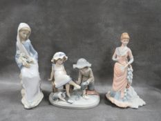 A Coalport Age of Elegance figurine 'Command Performance', together with two Lladro figurines (3)