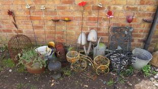 A large selection of metal garden ornaments to include zinc galvanised watering cans