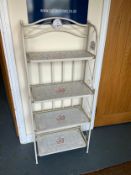 A metal and tiled four tier folding book case