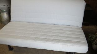 An Ikea sofa bed and cover