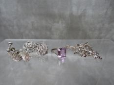 AN AMETHYST SET SILVER DRESS RING, together with a small collection of silver and marcasite