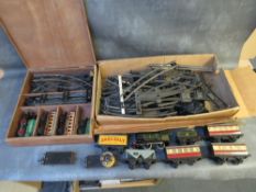 TWO VINTAGE HORNBY O GAUGE CLOCKWORK TRAIN SETS, to include steam locomotives, tenders, rolling