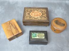 AN INLAID MUSIC BOX, together with a Mauchline ware cotton reel box, a Crystal Palace box and an