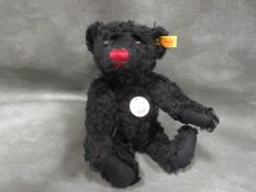 A BLACK CLASSIC STEIFF BEAR, with yellow label 005992 167A PA 4588 (DE), 55% wool, 45% cotton,