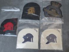 FOUR DIVERS PATCHES, together with an O.C.A. submarine patch, average 10 cm