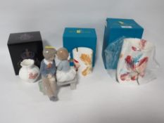 THREE BOXED ROYAL CROWN DERBY VASES, together with a Nao figurine (4)