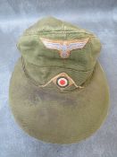 A WW2 GERMAN AFRIKA KORPS M41 OTHER RANKS FIELD CAP, olive green type, complete with Bevo type
