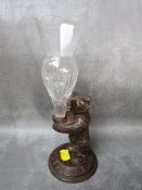 A BLACK FOREST BEAR HOLDING A GLASS SPECIMEN VASE, bear H 12 cm, overall H 22 cm