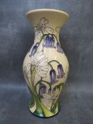 A MOORCROFT LIMITED EDITION 'BLUEBELLS & DAISIES' PATTERN BALUSTER VASE, designed by Paul