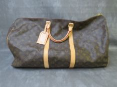 LOUIS VUITTON MONOGRAM WEEKEND / TRAVEL BAG, with leather detailing, shoulder strap, luggage tag,