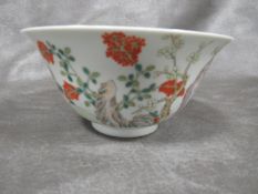 A CHINESE CIRCULAR BOWL WITH A SIX CHARACTER MARK TO BASE, decorated with a typical landscape with