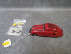 A RARE RED SCHUCO KOMMANDO ANNO 200 ORIGINAL TIN PLATE MODEL, made in Germany