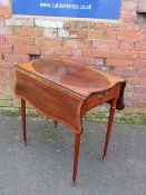 A 19TH CENTURY MAHOGANY AND CROSSBANDED PEMBROKE TABLE, having a shaped top and leaves, single