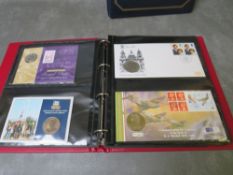 TWO ALBUMS OF COIN COVERS, to include royalty, Navy, Nelson, football and Nobel prize souvenir