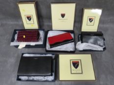 FOUR BOXED ASPINAL OF LONDON LEATHER BAGS, to include a two-tone red and black leather clutch bag, t