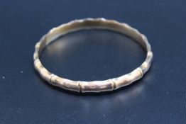 A HALLMARKED 9 CARAT GOLD BAMBOO EFFECT BANGLE, approx weight 7.5g