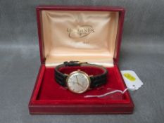 A LONGINES 9CT GOLD 'FLAGSHIP' AUTOMATIC WRISTWATCH, in original box, Dia. 3 cm
