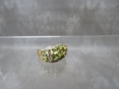 A HALLMARKED 9CT GOLD PERIDOT STYLE GEMSET DRESS RING, ring size R, approximate weight 4.5 g