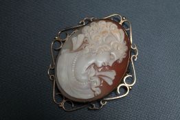 A LARGE CAMEO BROOCH, mounted in gold plated wirework setting, H 7 cm