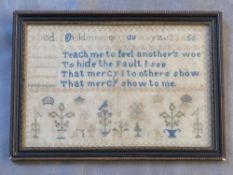 A 19TH CENTURY NEEDLEWORK SAMPLER, framed and glazed, 19 x 29 cm